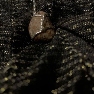 Wire wrapped granite pendant.